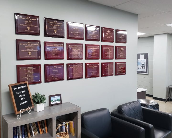 Rm Trucking Driver Awards Plaques on a wall