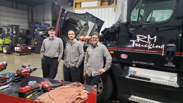 Three RM Trucking employees in the shop