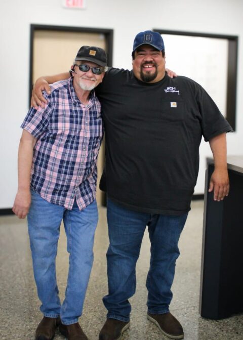 Two RM Trucking employees in the office.